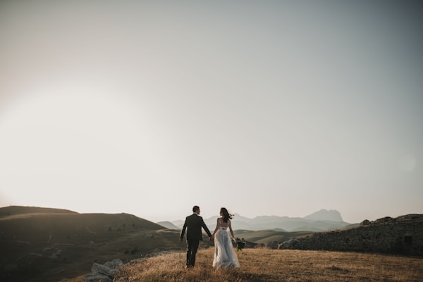 How Are Intricate Details Like Lace Appliqués Securely Attached to a Wedding Dress?