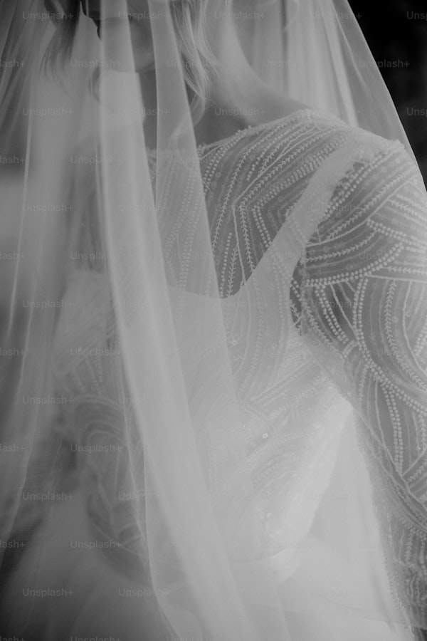 Unveiling the Craft: What Methods Are Used to Create a Wedding Dress with Unique Lace Cutouts?